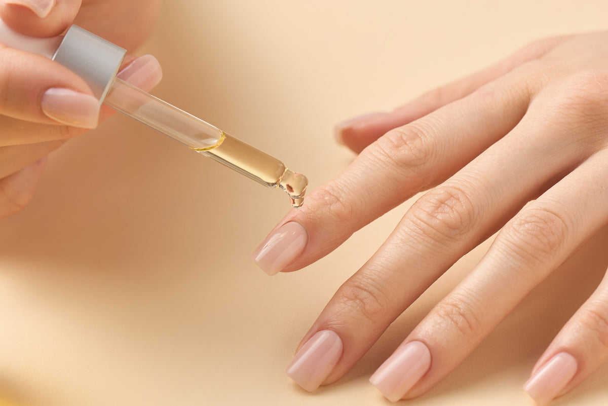 cuticle oil being applied to healthy nails