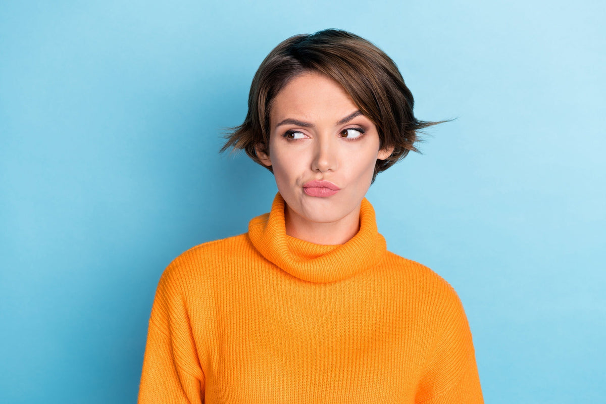 Attractive woman deciding over a nail kit