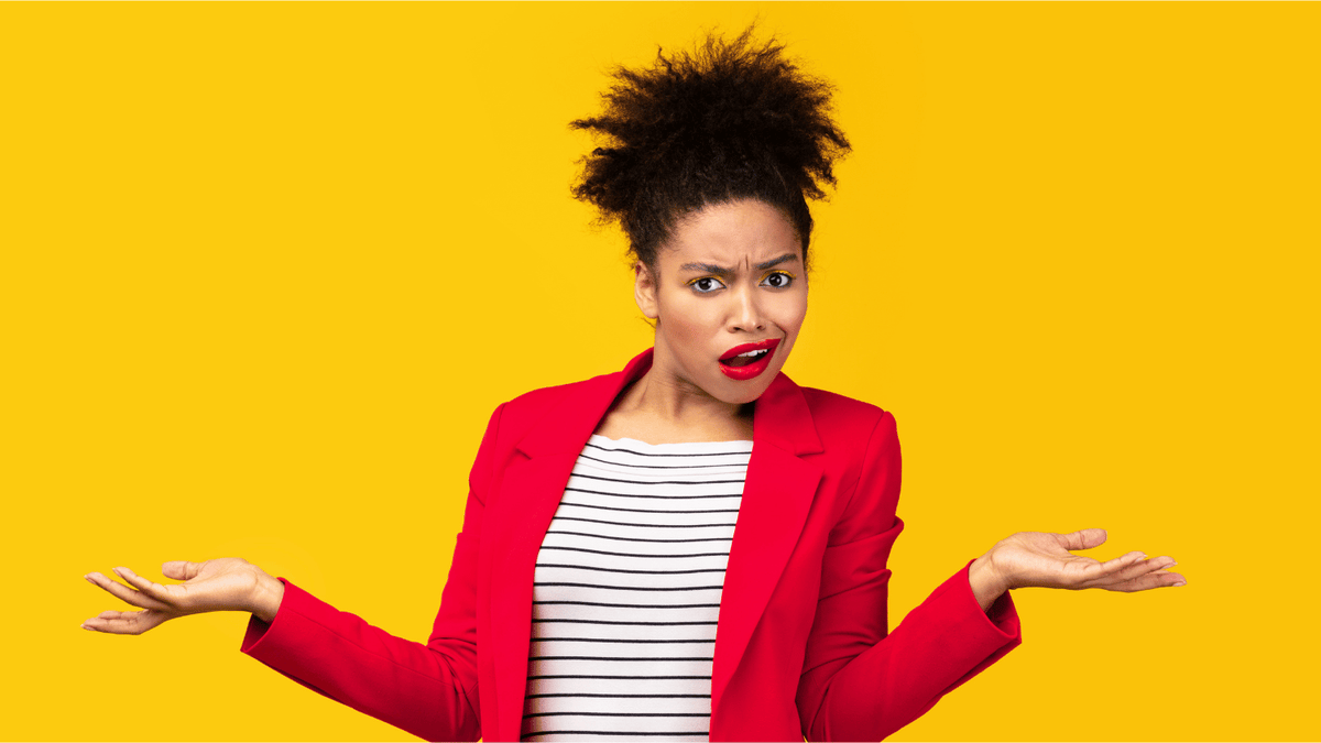 Confused woman with arms outstretched against a yellow background