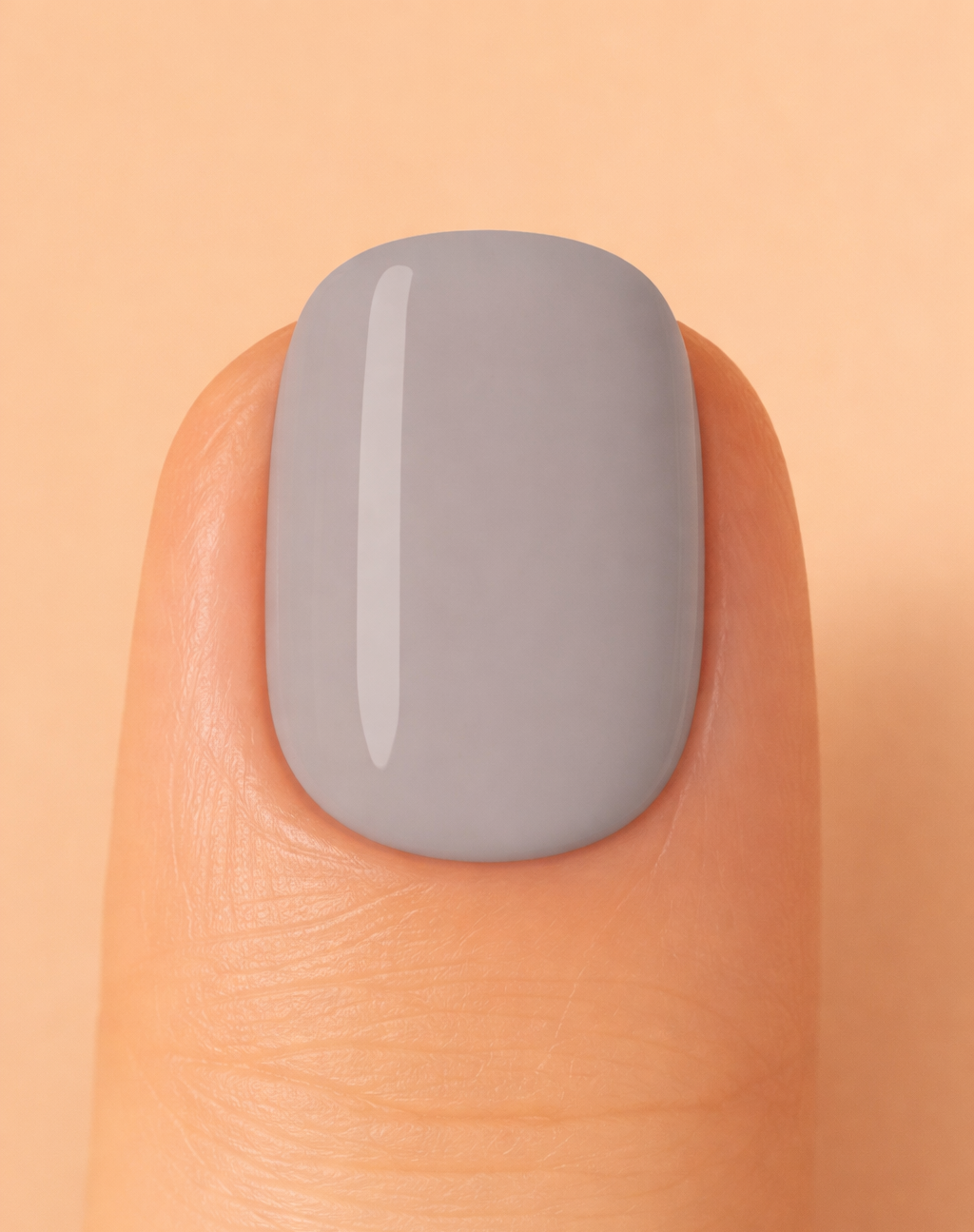 Grey colour nail on beige background